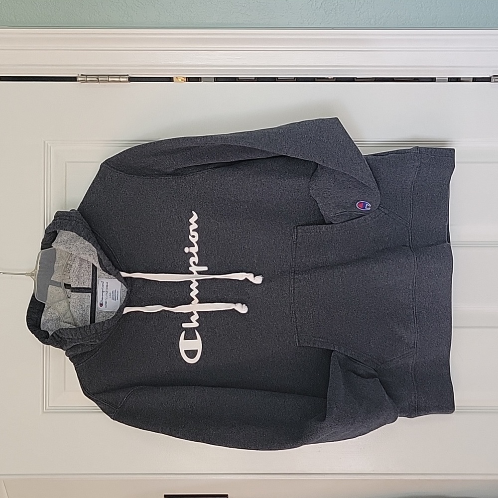 Champion hoodie. Dark grey, off-white logo on chest eeide strings. Stitched logo